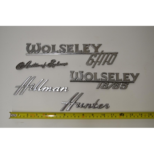 572 - Five vintage chromed car manufacturers signs including Wolsey 6/110, Hillman Hunter, Austin of Engla... 