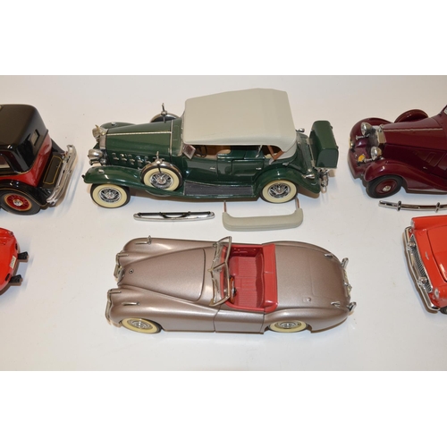 670 - 7 Franklin Mint 1/18 diecast model cars.