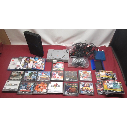 799 - Playstation and PS2 consoles with games and controllers