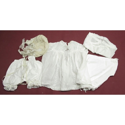 896 - Collection of Edwardian and later Doll and baby clothing in various colours and materials