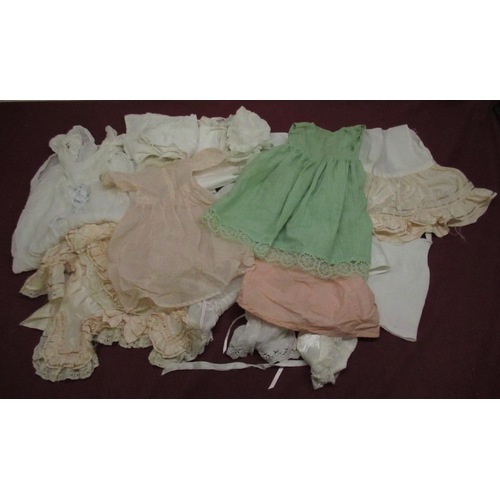 897 - Collection of Edwardian and later Doll and baby clothing in various colours and materials