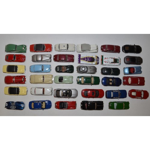 692a - Collection of 35 mostly 1:43 scale model cars, mostly Atlas additions, all un boxed