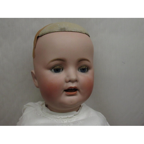 894 - German early C20th bisque headed doll indistinctly marked to back of neck with makers mark and numbe... 