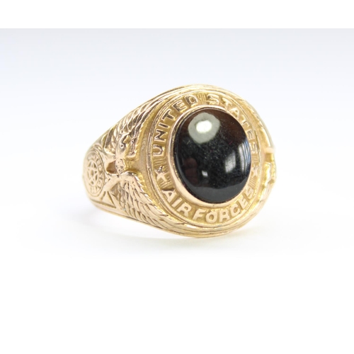 21 - Mid C20th US Airforce 10 carat gold fraternity type signet ring with central black onyx stone, flank... 