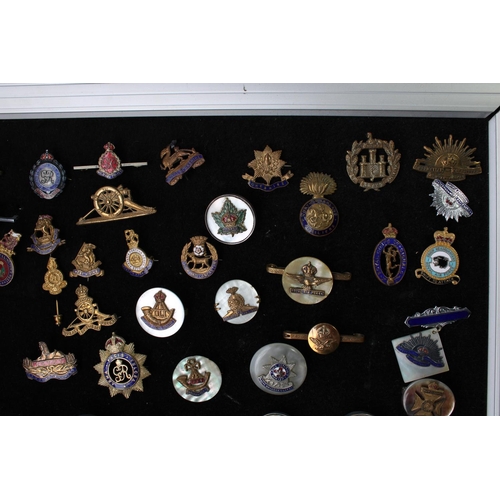 25 - Large collection of British military regimental sweetheart brooches, enamel pins etc with some commo... 
