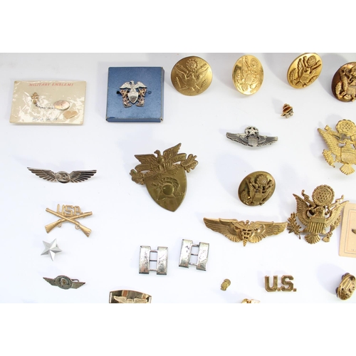 45 - Large selection US military insignia, badges, titles, pips etc. Mostly WW2 era with a small few late... 
