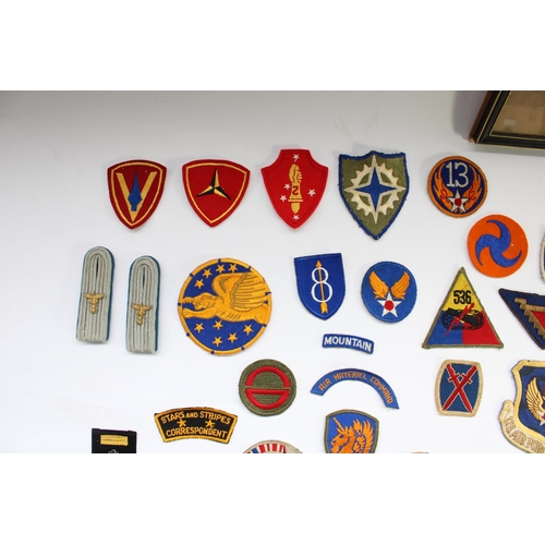51 - Good collection of US military regimental and squadron cloth badges and patches, mainly WW2 era incl... 