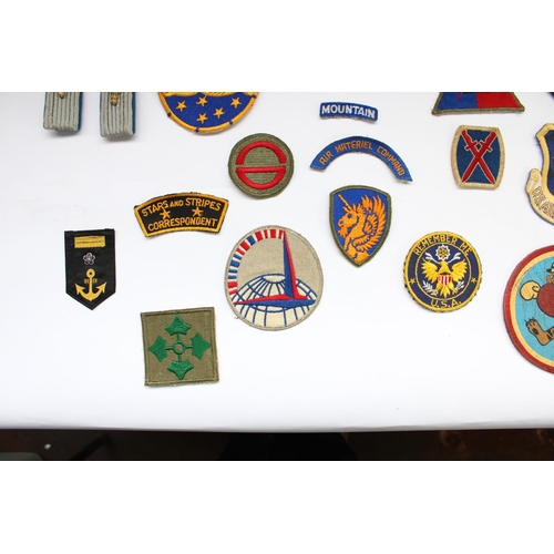 51 - Good collection of US military regimental and squadron cloth badges and patches, mainly WW2 era incl... 