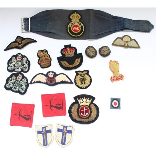56 - Selection of British military WW2 era cloth and bullions badges and patches, including Voluntary Aid... 