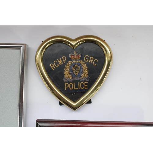 66 - Collection of world police badges and patches including Canadian Mounties, Hong Kong Narcotics Burea... 