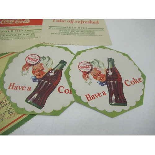 286 - Four Coca-Cola cheques c.1944, one date stamped Oct 8 1944, 2 Coca-Cola cardboard coasters and 2 Coc... 