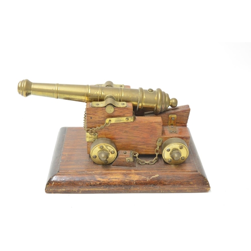 472 - Model naval canon, wood and brass (non functioning, no firearms licence required to own) and a naval... 