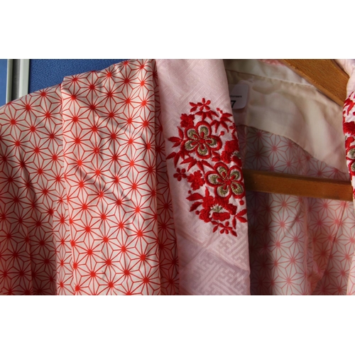 327 - Three quarter length kimono with embroidered collar and lapels, with overall geometric pattern, shou... 