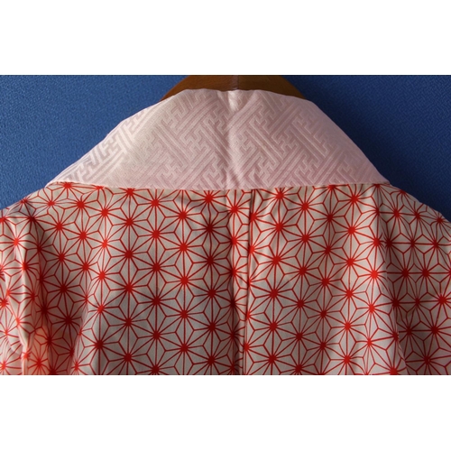 327 - Three quarter length kimono with embroidered collar and lapels, with overall geometric pattern, shou... 