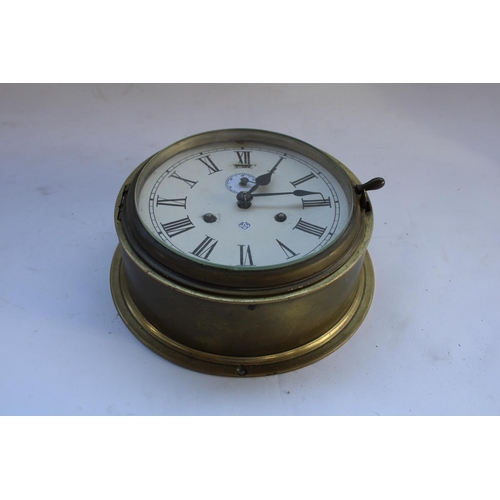 448 - Mid C20th brass ships clock, Roman Numerals on printed card face, diameter of face 16cm (hinge A/F)