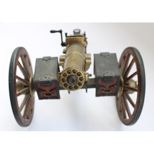 85 - Cast metal model of an 1883 Gatling Gun, L38cm (wheel snapped at joint with old glue mark, will requ... 