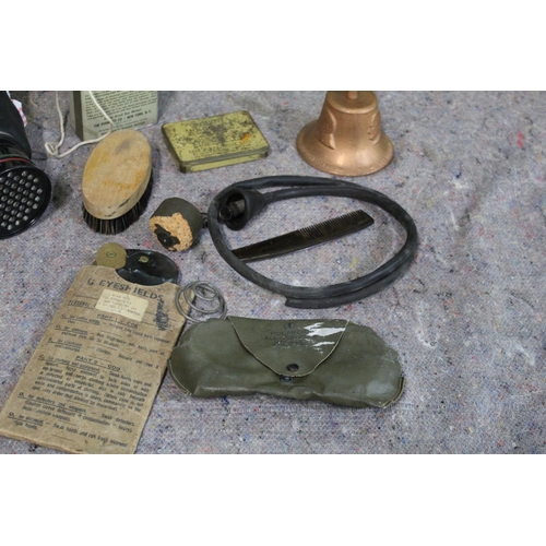 335 - WWII military related items, including gas mask, water purifier, tin containing drinking water kit, ... 