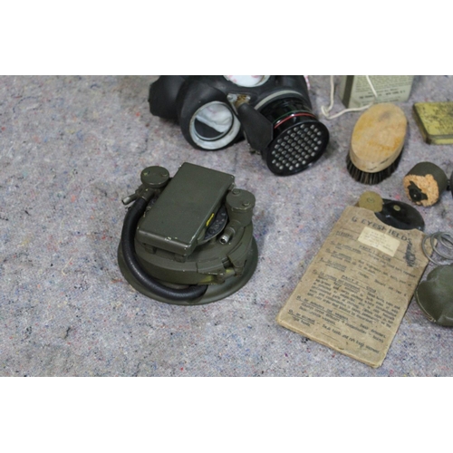 335 - WWII military related items, including gas mask, water purifier, tin containing drinking water kit, ... 