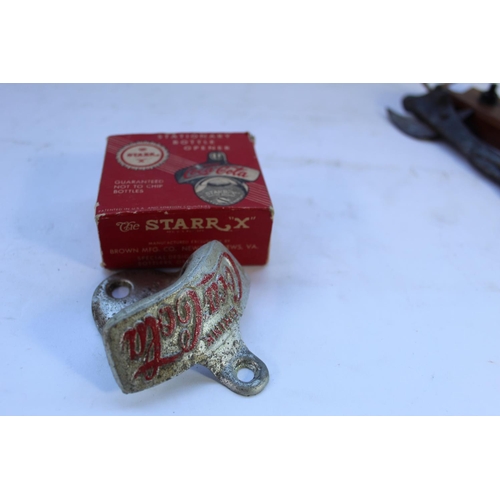 358 - Boxed stationery bottle opener by Coca-Cola, a Bulley Beef bull tin opener and a novelty wooden tabl... 