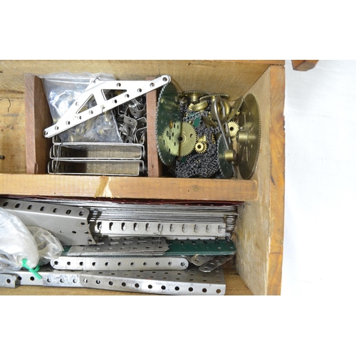 507 - Wooden chest containing a large amount of vintage meccano with instructions, electric motor, wheels,... 