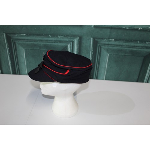 163 - J. Collett 1944 National Fire Service cap with red piping and metal badge