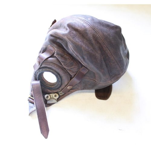 111 - WWII period leather flying helmet (good condition with possible replacement earphone straps, chin st... 
