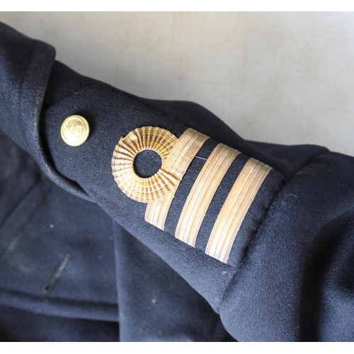 143 - Royal Naval Officers great coat, with anchor brass buttons, two outside pockets, fully lined with of... 