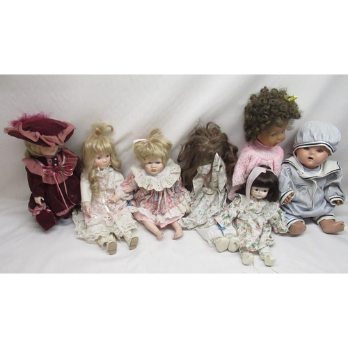 395 - Early to mid C20th papier mache doll together with six modern porcelain dolls and one other plastic ... 