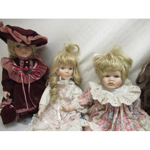 395 - Early to mid C20th papier mache doll together with six modern porcelain dolls and one other plastic ... 