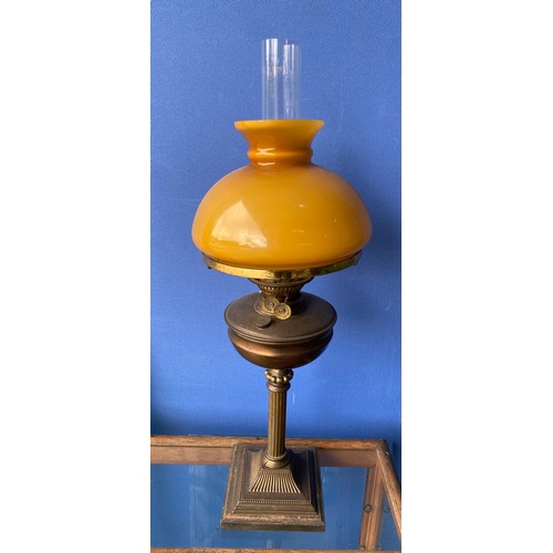 375 - Large brass oil lamp with amber coloured shade