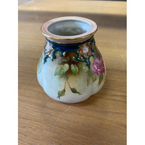 380 - Royal Worcester vase with roses and gilded highlights, base stamped 291 H10.49