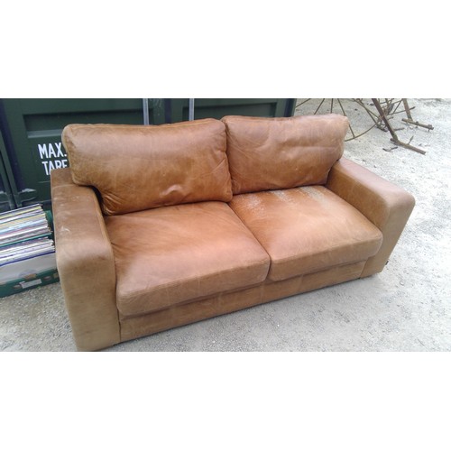 574 - Two seater sofa, upholstered in brown leather W197cm