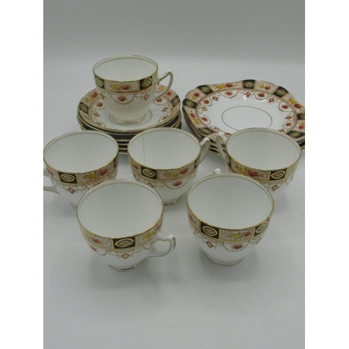 219 - Early 20th C Melba bone china 17 piece dinner service decorated in burnt orange a blue with gilt hig... 