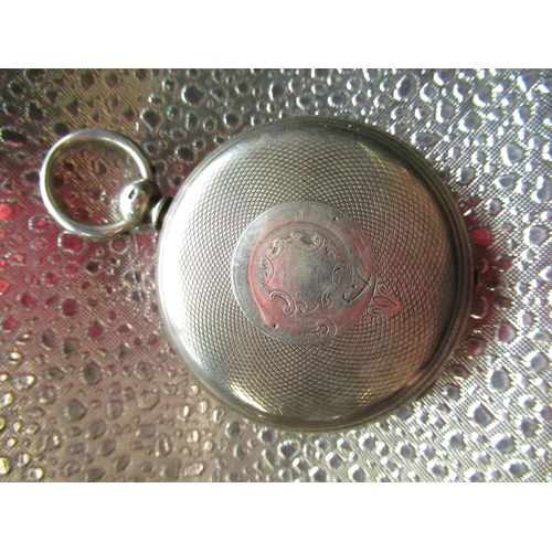 287 - Victorian silver open faced key wound pocket watch, hinged cased back and bezel with bright cut deco... 