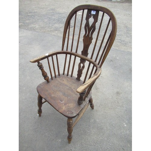 562 - C19th elm Winsor chair, pierced splat on turned ring legs with H stretcher