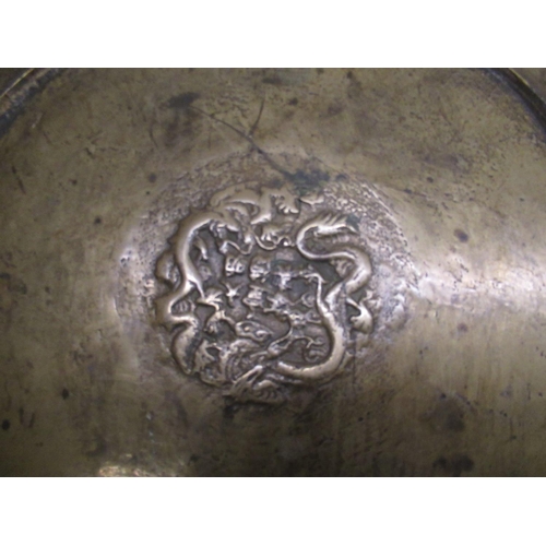 227 - C20th Chinese brass charger with engraved dragon to centre surrounded by a Greek key border the oute... 