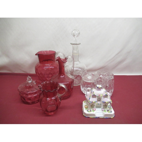 310 - Large Cranberry glass jug, two smaller cranberry glass jugs both with shaped rim and a cranberry gla... 