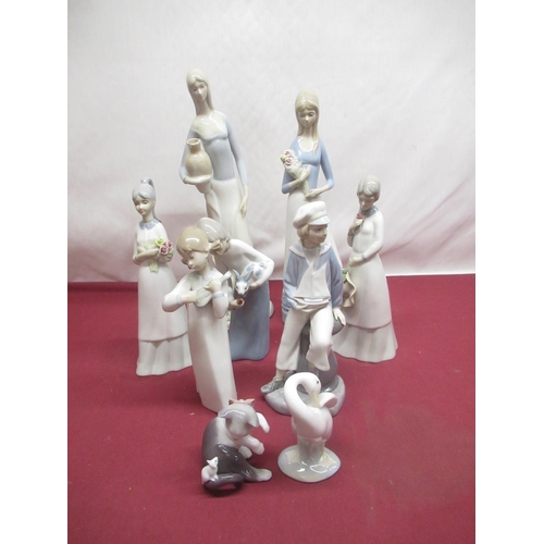 313 - Lladro figurine of a sailor boy, girl playing a fiddle (AF) and a kitten wearing a pink bow and thre... 