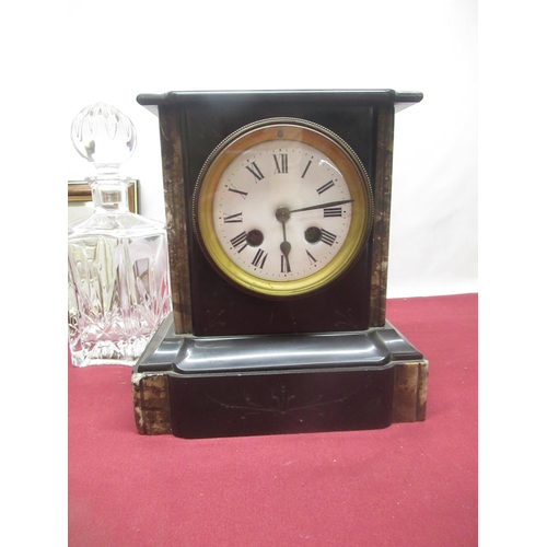317 - Two glass decanters and two wooden cased mantle clocks
