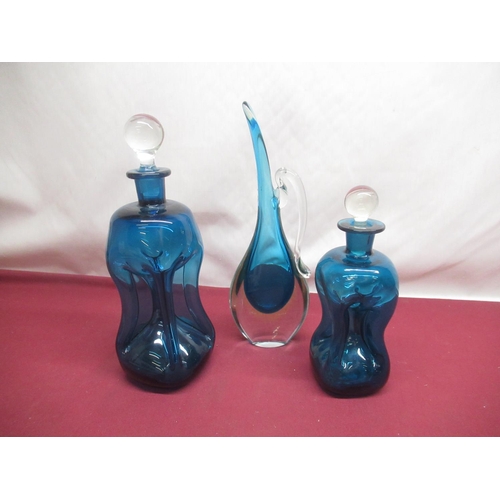 345 - Pair of blue glass decanters and blue & clear glass jug,