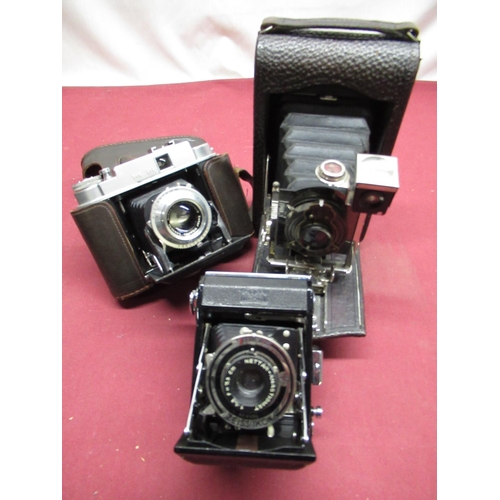 164 - A box of various folding cameras including Zeiss Ikon Netta, Ensign etc (qty)