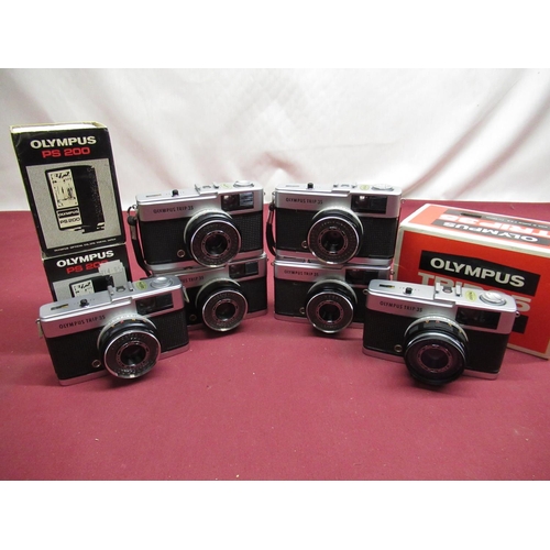 169 - Seven Olympus trip 35 cameras (1 boxed) and two boxed Olympus PS200 flashguns