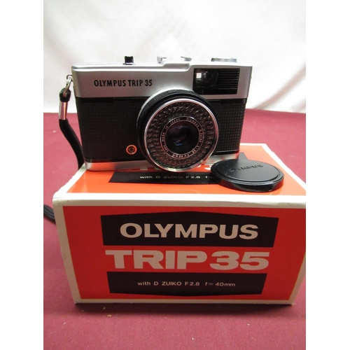 169 - Seven Olympus trip 35 cameras (1 boxed) and two boxed Olympus PS200 flashguns