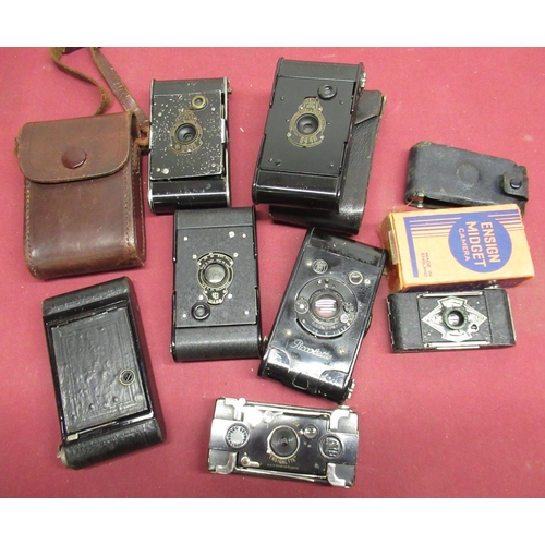 172 - Various miniature folding cameras including Kodak soldiers type compact folding cameras, Ensignette,... 