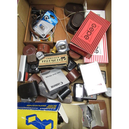 173 - Box of various camera accessories including light meters, lens hoods, flash guns, slide duplicator e... 