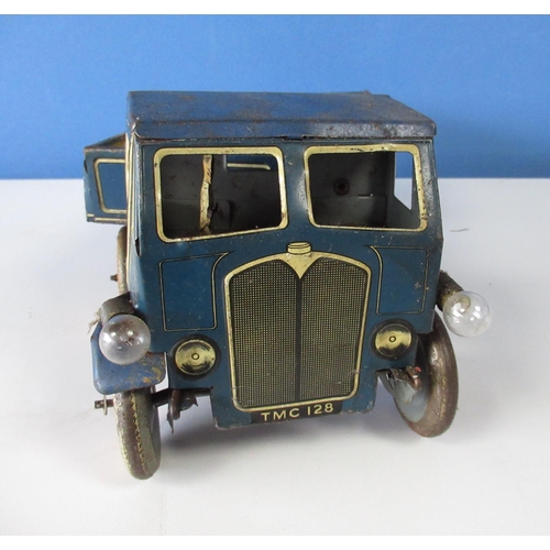 576 - Mettoy blue tinplate clockwork lorry and trailer with cream detail, red wheels with white tyres, lat... 