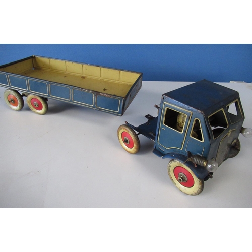 576 - Mettoy blue tinplate clockwork lorry and trailer with cream detail, red wheels with white tyres, lat... 