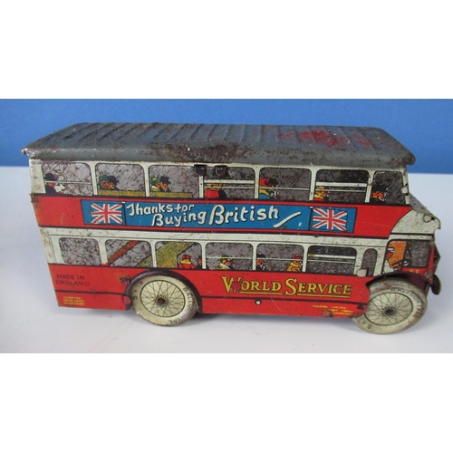 581 - Wells World Service tinplate clockwork double decker bus , a tinplate lorry cab and a tinplate tippi... 