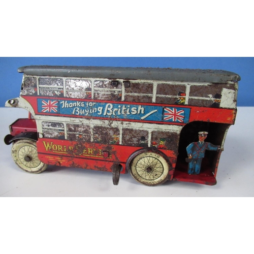 581 - Wells World Service tinplate clockwork double decker bus , a tinplate lorry cab and a tinplate tippi... 