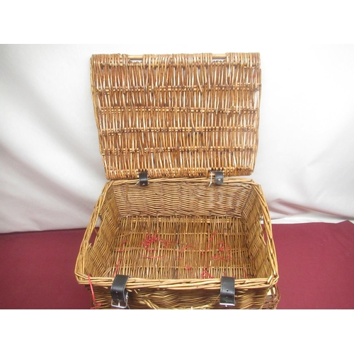 409 - Wicker picnic basket with checked interior, a set of four plastic plates, mugs and cutlery and anoth... 